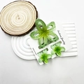 Set of three gradient green marble frangipani hair clips on a decorative white tray - Hollow Plumeria Green Set (With Card)