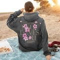 Dark grey oversized hoodie featuring pink floral print and Jesus Loves You back graphic - S / Dark Gray
