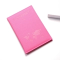 Detail of rose pink matte PU leather passport cover with world map and airplane embossing - Rose Red