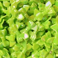 Glossy bright green bow-shaped beads for DIY jewelry making and craft projects - Green
