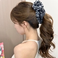 Macro shot of large black and white animal print scrunchie on a ponytail - Black White Zebra Pattern Cloth Style