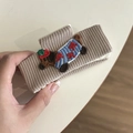 Detail of cream knitted hair claw clip featuring embroidered dachshund dog design - 13# Milk Tea Hair Claw Dog