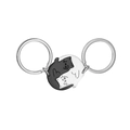 Macro view of black and white hugging cat stainless steel keychains in Tai Chi design - Black and White Splicing Cat Pair