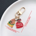 Detail view of Christmas keychain showing reindeer pendant and 5.7cm total length - ER832-Enamel Christmas Gift Reindeer Bag U-shaped Keychain
