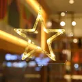 Hanging star-shaped LED window light with warm white glow for Christmas decor - Pentagram