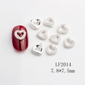 Silver hollow heart and pearl nail art charms on red fake nails, 7.8x7.5mm size - LF2014 Silver Pearl Hollow Heart