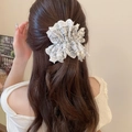 Floral fabric scrunchie with white lace edges shown on wavy brown hair - Pale Purple Floral Lace (47#)