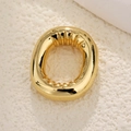 Macro view of gold-plated balloon letter pendant showing inner wavy textures and polished finish - Letter O