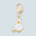 Detail of cartoon duck on skateboard keychain with heart-shaped gold lobster clasp - Skateboard Duck