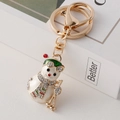 Porte-clés bonhomme de neige de Noël, thème ski, en métal doré et émail blanc - Bonhomme de neige