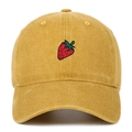Close-up of strawberry embroidery on yellow washed cotton baseball cap with vintage finish - Yellow