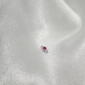 Detail of S925 silver pendant connector with pink gemstone on white satin fabric - Silver Red Zircon