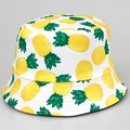 Reversible bucket hat with yellow pineapple print on a white fabric base for summer - M / Pineapple Yellow
