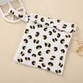 Close-up of leopard pattern baby diaper bag with snap closure and soft cotton fabric - Leopard 1