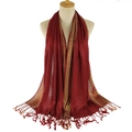 Dark red scarf with gold metallic trim and elegant tassels on a display bust - Burgundy