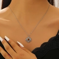 Bohemian silver evil eye pendant necklace with tiger eye stone on elegant female model - Evil Eye Style (1098)