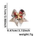 Beige Christmas bow with snowman print, bells, and size specs: 10.1cm x 9.47cm - Style N