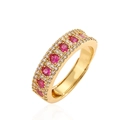 18K gold plated ring featuring three rows of red rubies and white crystals on white backdrop - Gold Plated Rose Red Zirconia
