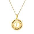 Detail of a gold-plated necklace featuring a crystal-set circular pendant with letter D - Letter D