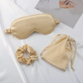 Three-piece champagne silk sleep set including eye mask, scrunchie, and storage bag - Gold