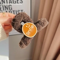 Dark brown plush hair claw clip featuring an orange smiley face disc and Smile text - Smile Plush Clip / Dark Coffee