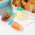 Mini carrot-shaped condiment squeeze bottles in orange and yellow with a plastic dropper - Carrot Shape Set of 3