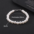 Detail showing 8mm white pearls on a 20cm strand with a polished silver metal clasp - 8mm Bead - 20cm Bracelet