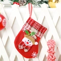 Detail of red felt Christmas stocking featuring a 3D snowman with holly and bells - Bell Snowman / Small