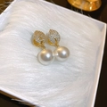 Gold plated leaf zircon earrings with hanging white pearls on a plush white display - Gold Leaf Pearl Ear Clip (18#)
