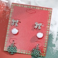 Christmas earring set with rhinestone bow, white snowball, and green snowflake on card - 29 Snowflake Style H-150