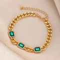 Gold chain bracelet featuring three emerald-cut green gems with a luxury vintage style - Gold Rhinestone Emerald Bracelet (A-1001)