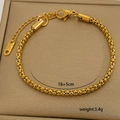 Macro detail of gold plated stainless steel chain showing 18+5cm length and clasp - Fine Woven Chain (10-13)