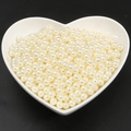 Creamy white round faux pearls stored in a white heart-shaped plate for DIY jewelry - 6mm Diameter Approx 200Pcs/Bag / Beige
