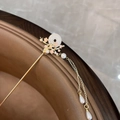 Close-up of golden hair pin with white jade disc, pink flowers and pearl tassels - Small Flower Round Jade Hairpin - White