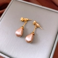 Detailed close-up of French vintage gold pearl drop earrings on premium jewelry box - S925 Silver Pin Gold Champagne Pink Waterdrop Pearl Style