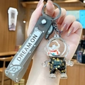 Black gold astronaut keychain with grey strap and golden star liquid quicksand pendant - Black Gold Astronaut - Female Style