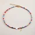 Detailed view of colorful beaded necklace with white heart and gold J letter pendant - Letter J