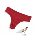 Detailed macro shot of red ribbed cotton fabric texture on women's thong underwear - Burgundy