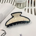 Pince à cheveux minimaliste en acétate avec strass colorés sur un livre ouvert - Grande Pince À Cheveux Color-Block / Env. 8,5 cm