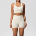 Close-up of cream white yoga set with racerback bra and high-waisted shorts - Light Ivory