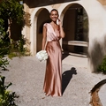 Detail of elegant V-neck satin maxi dress in rose gold with seamless shoulder design - Pink