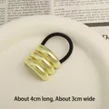 Elastic hair tie with three gold curved metal cylinders, 4cm x 3cm stylish hair accessory - Triple Layer Arc Gold