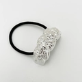 Close-up of black elastic hair tie with textured silver-tone irregular metal detail - Sand Silver Type 3