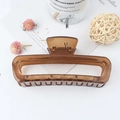 Brown leopard print rectangular hair claw clip in a glossy finish on white background - Jelly Brown