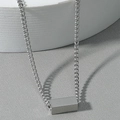 Macro view of polished silver cube pendant on sleek curb chain necklace - Rectangular