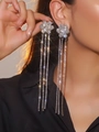 Elegant long silver tassel earrings with sparkling rhinestones for women shown on model - Silver Flower Rhinestone Tassel