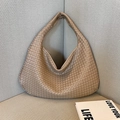 Elegant beige woven texture handbag with minimalist crescent design and smooth leather finish - Khaki