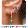 Close-up of golden cartilage earring set with blue gemstone clover and 12 color options - September Sapphire