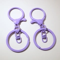 Detail of purple painted metal lobster clasps and key rings for DIY accessory making - Purple (Painted)