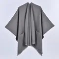 Women's dark gray knitted poncho shawl with front pockets and elegant tassel fringe - Single Color with Pocket and Frayed Edge / Gray